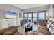 Open living area with plush sofas, decorative elements, and water views at 4310 Falmouth Dr # 102, Longboat Key, FL 34228