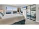 Bedroom with mirrored closet doors and a lovely outside view at 4310 Falmouth Dr # 102, Longboat Key, FL 34228