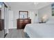 Bright bedroom with a dresser, mirror and closet at 4310 Falmouth Dr # 102, Longboat Key, FL 34228