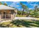 Large backyard area featuring a concrete patio and screened-in porch at 4540 Maverick St, North Port, FL 34288