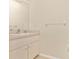 Powder room featuring a white sink with silver faucet and a large mirror at 4540 Maverick St, North Port, FL 34288