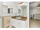 Bathroom featuring granite-topped vanity, modern fixtures, and a well-lit mirror over the sink at 4540 Maverick St, North Port, FL 34288