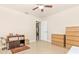 Bedroom featuring tile floors, neutral walls, closet, and standard ceiling fan at 4540 Maverick St, North Port, FL 34288