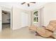 Bedroom featuring tile floors, neutral walls, closet, ceiling fan, and natural light at 4540 Maverick St, North Port, FL 34288