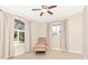 Bedroom featuring tile floors, neutral walls, ceiling fan, and natural light at 4540 Maverick St, North Port, FL 34288