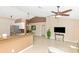 Open-concept living area featuring tile floors, neutral paint and a seamless flow into the kitchen at 4540 Maverick St, North Port, FL 34288