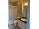 A cozy bathroom with a vanity sink, a toilet, and a shower-tub combo with a shower curtain at 4802 51St W St # 1210, Bradenton, FL 34210