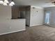 Inviting living room featuring neutral-colored walls, plush carpeting, and modern lighting at 4802 51St W St # 1210, Bradenton, FL 34210