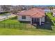 Aerial view of backyard featuring a rod iron fence, screened in lanai, and a beautiful neighborhood at 4802 68Th Street E Cir, Bradenton, FL 34203