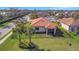 Aerial view of backyard featuring a rod iron fence, screened in lanai, and a beautiful neighborhood at 4802 68Th Street E Cir, Bradenton, FL 34203