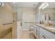 Modern bathroom features a tiled shower, double vanity, and elegant fixtures at 4802 68Th Street E Cir, Bradenton, FL 34203