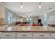 Kitchen features a granite island with white cabinets and drawers facing the Gathering and dining rooms at 4802 68Th Street E Cir, Bradenton, FL 34203