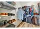 Organized walk-in closet with wire shelving and hanging racks offers ample storage space at 4802 68Th Street E Cir, Bradenton, FL 34203