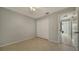 A basic bedroom featuring tile flooring, a ceiling fan, and a closet with double doors at 4937 Thames Ln, Sarasota, FL 34238