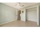 A basic bedroom, the closet has an open door, and the floor is tiled at 4937 Thames Ln, Sarasota, FL 34238