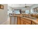 Bright kitchen featuring stainless steel appliances and a view into the adjacent living area at 4937 Thames Ln, Sarasota, FL 34238