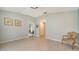 Bright living room with tile floors, showing access to other rooms in the home at 4937 Thames Ln, Sarasota, FL 34238