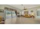 Cozy living room with access to the outdoor patio and lots of natural light at 4937 Thames Ln, Sarasota, FL 34238