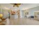 Open-concept living room featuring tile floors and seamlessly connected kitchen area at 4937 Thames Ln, Sarasota, FL 34238