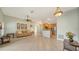 Bright living area with tile floors, and an open view to the modern kitchen at 4937 Thames Ln, Sarasota, FL 34238