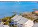 An aerial view of the property overlooking the bay with boat docks, offering stunning waterfront views at 5031 N Beach Rd # 222, Englewood, FL 34223