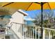 Relaxing balcony with seating and tables, offering stunning water views and a perfect spot for outdoor dining at 5031 N Beach Rd # 222, Englewood, FL 34223