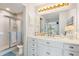 Renovated bathroom features a shower and a vanity with abundant storage space at 5031 N Beach Rd # 222, Englewood, FL 34223