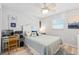 Beach-themed bedroom features a desk area, ceiling fan, and soothing decor at 5031 N Beach Rd # 222, Englewood, FL 34223