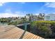 Picturesque dock leading to waterfront homes, set against a backdrop of lush greenery at 5031 N Beach Rd # 222, Englewood, FL 34223