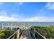 Private wooden dock with secure railings, perfect for boating, fishing, and enjoying breathtaking waterfront scenery at 5031 N Beach Rd # 222, Englewood, FL 34223