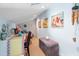 Upstairs loft area is cozy, with beach-themed artwork and colorful accents at 5031 N Beach Rd # 222, Englewood, FL 34223