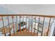 View of the bright living area from the nautical-themed loft with decorative railing and beach decor at 5031 N Beach Rd # 222, Englewood, FL 34223