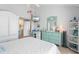 Bright bedroom offers ample storage and a view into the ensuite bath area at 5031 N Beach Rd # 222, Englewood, FL 34223