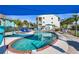 The kidney-shaped pool is surrounded by lounge chairs and a covered patio area, perfect for relaxation at 5031 N Beach Rd # 222, Englewood, FL 34223