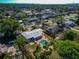 Wide aerial view of the home showcasing the pool, patio, and the neighborhood at 507 67Th W Ave, Bradenton, FL 34207