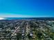 A calm, clear aerial shot of the neighborhood that overlooks a beautiful ocean at 507 67Th W Ave, Bradenton, FL 34207