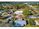 Aerial view of home nestled in a neighborhood with mature trees and landscaping at 507 67Th W Ave, Bradenton, FL 34207