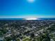 Clear aerial view of the neighborhood and ocean on the horizon on a sunny day at 507 67Th W Ave, Bradenton, FL 34207