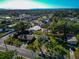 An elevated shot showcasing a house featuring a pool in a leafy neighborhood at 507 67Th W Ave, Bradenton, FL 34207