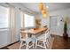 Chic dining area featuring a wooden table, comfortable seating, and stylish pendant lights at 507 67Th W Ave, Bradenton, FL 34207