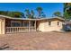 Charming single-story home with stone accents, a balcony, and a brick driveway at 507 67Th W Ave, Bradenton, FL 34207