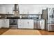 Kitchen area featuring stainless appliances, tile backsplash, and stainless sink at 507 67Th W Ave, Bradenton, FL 34207