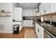 Galley kitchen with stainless appliances, and dark countertops at 507 67Th W Ave, Bradenton, FL 34207