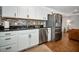 Kitchen area featuring stainless appliances, tile backsplash, and stainless sink at 507 67Th W Ave, Bradenton, FL 34207