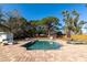 Backyard pool area complete with brick patio, lounge chairs, and lush landscaping at 507 67Th W Ave, Bradenton, FL 34207