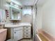 Retro bathroom featuring a pink sink, bathtub, and vintage fixtures at 511 50Th Avenue W Dr, Bradenton, FL 34207