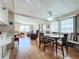 Inviting dining area featuring a ceiling fan, window blinds, and a view into the living area at 511 50Th Avenue W Dr, Bradenton, FL 34207