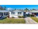 Charming single-story home with tidy landscaping, a long driveway, and a covered parking area at 511 50Th Avenue W Dr, Bradenton, FL 34207