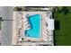 Aerial view of a community pool and surrounding lounge chairs at 511 50Th Avenue W Dr, Bradenton, FL 34207