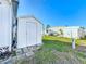 Outdoor shed in a well-maintained backyard with grass at 511 50Th Avenue W Dr, Bradenton, FL 34207